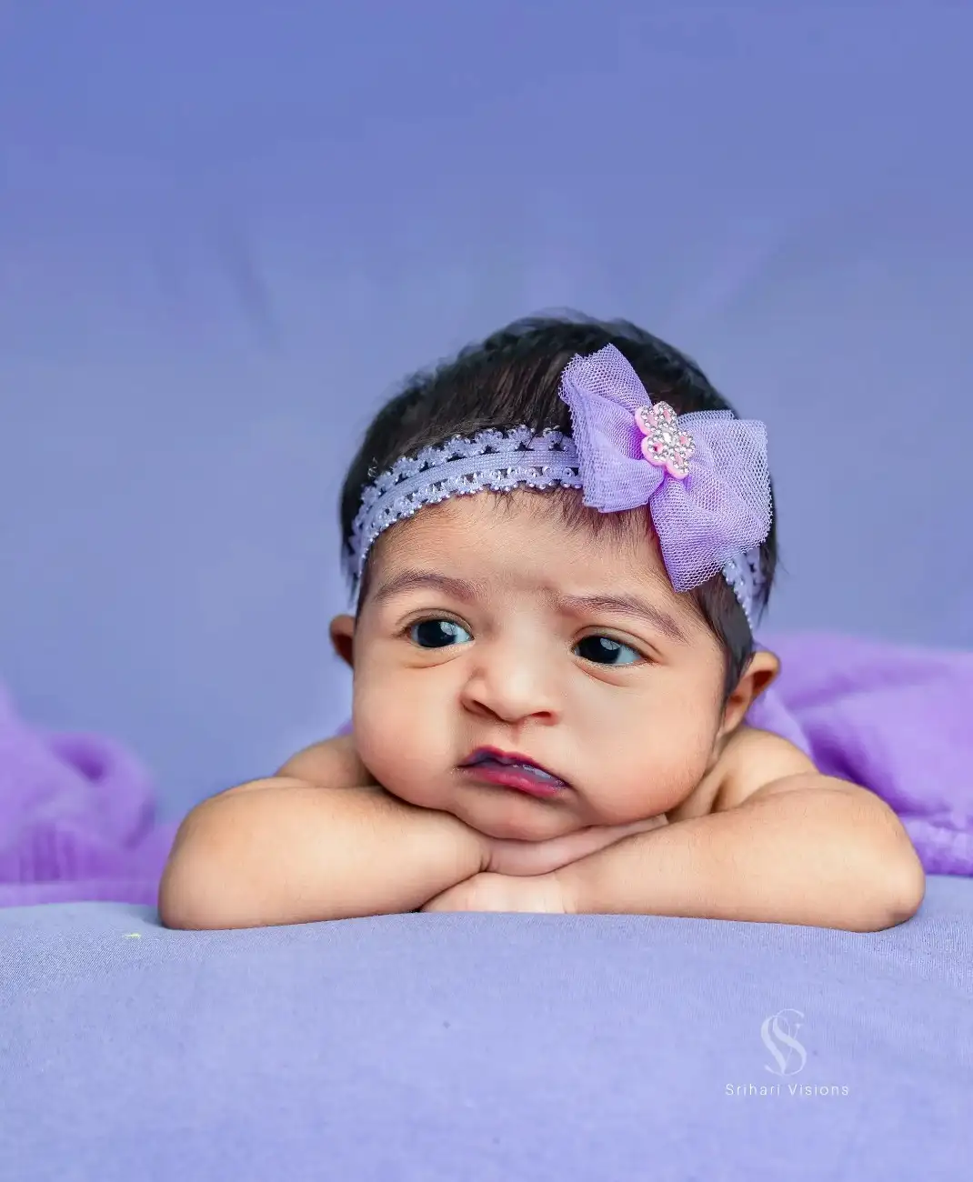 Professional newborn photography portrait of a baby