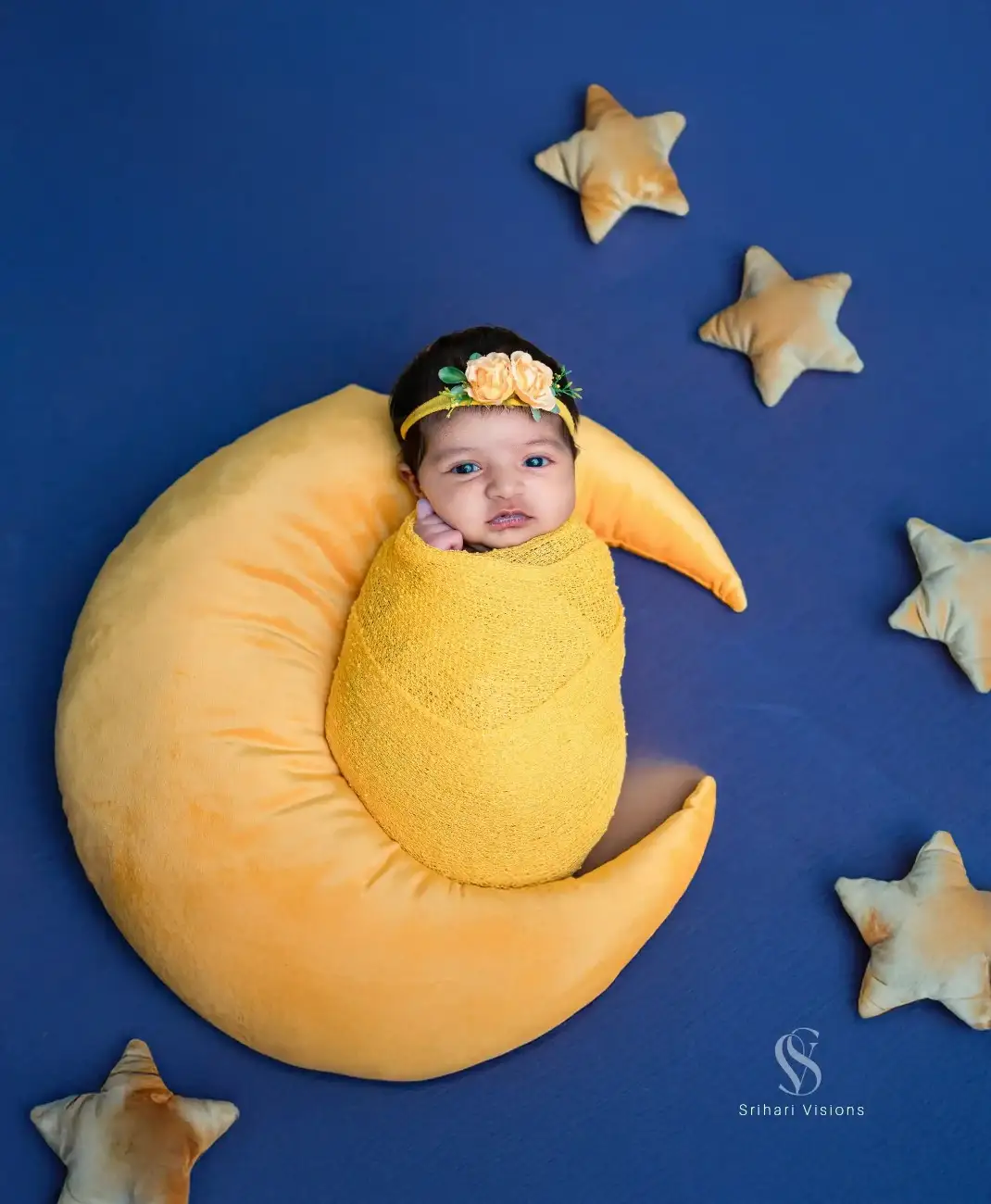 Newborn baby photoshoot featuring a cute themed setup