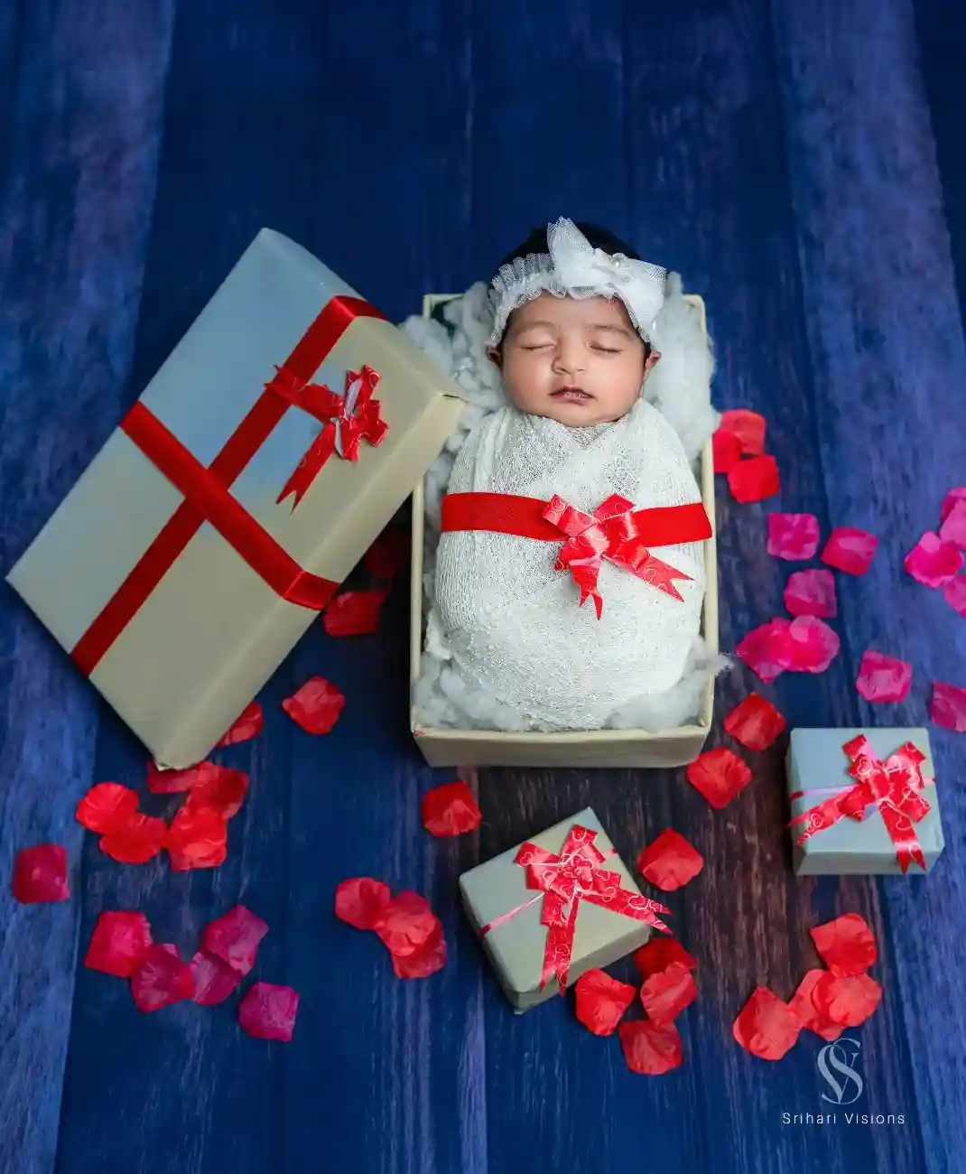 Tiny newborn baby resting peacefully during photoshoot