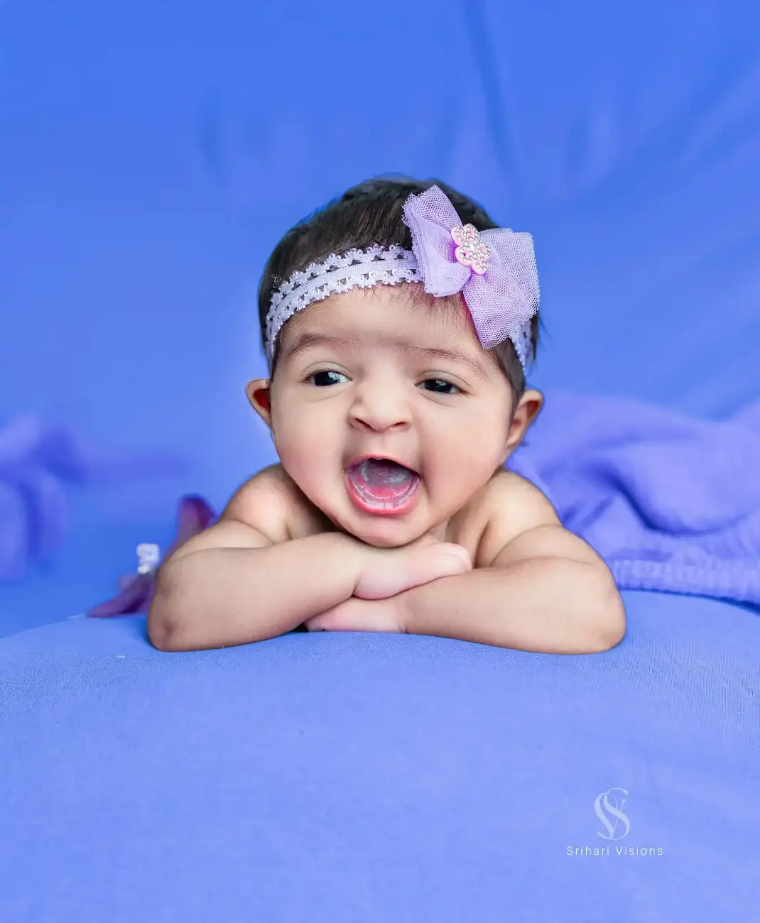 Newborn baby posing peacefully during a baby photoshoot