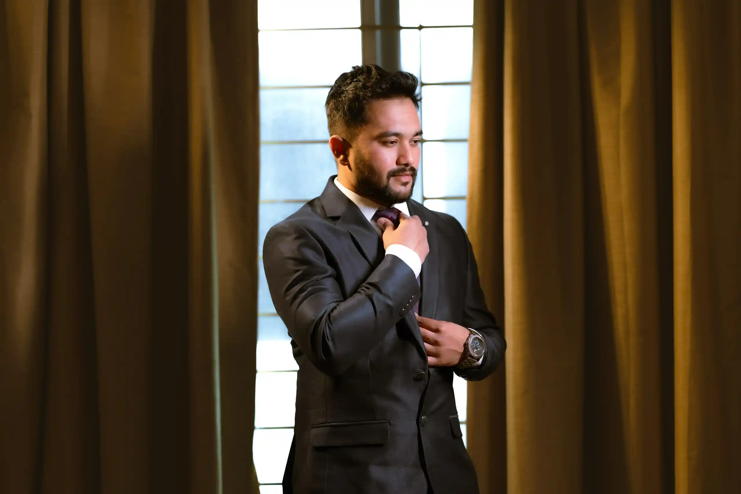 Groom posing for professional engagement photography