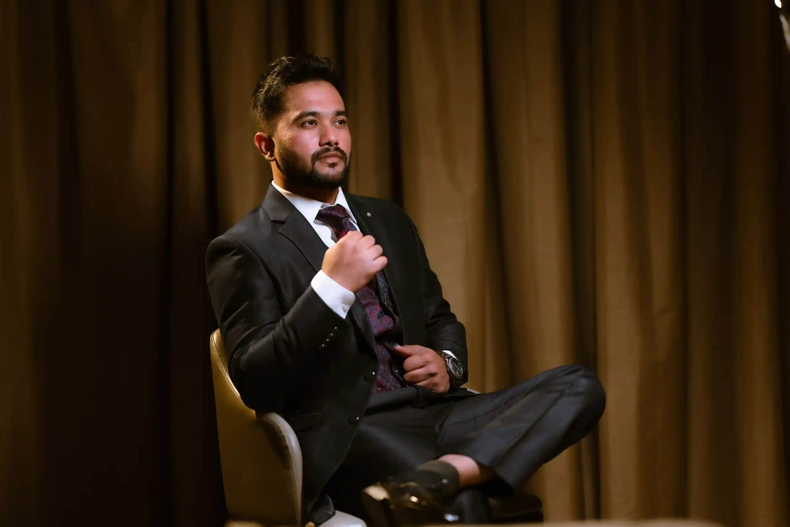 Groom posing for engagement photography
