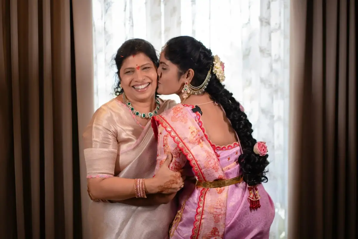 bride kissing her mother during engagement photography