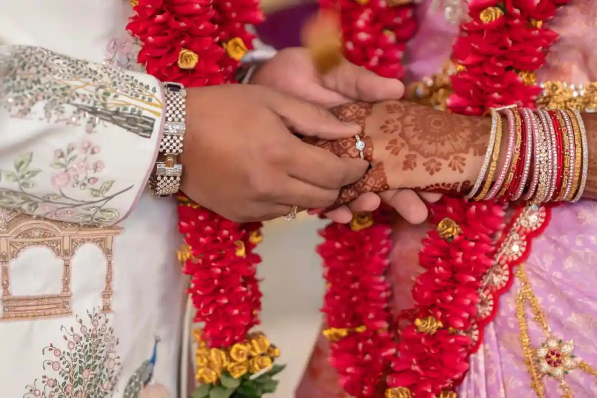 Engagement photography during traditional ring exchange ceremony