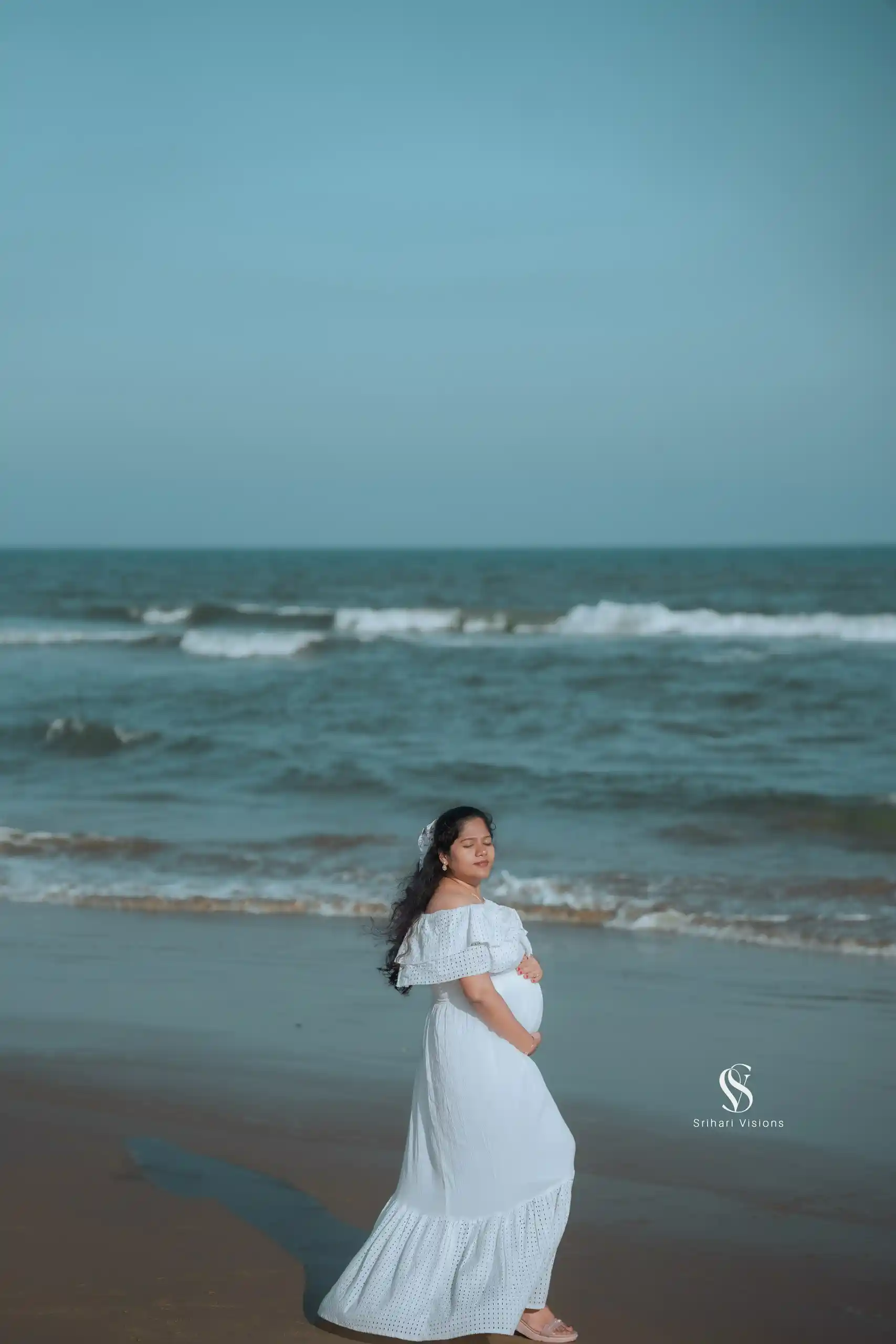 Couple embracing during a maternity photography session