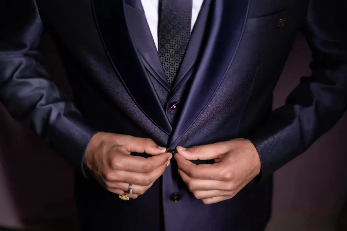 Groom standing during engagement ceremony