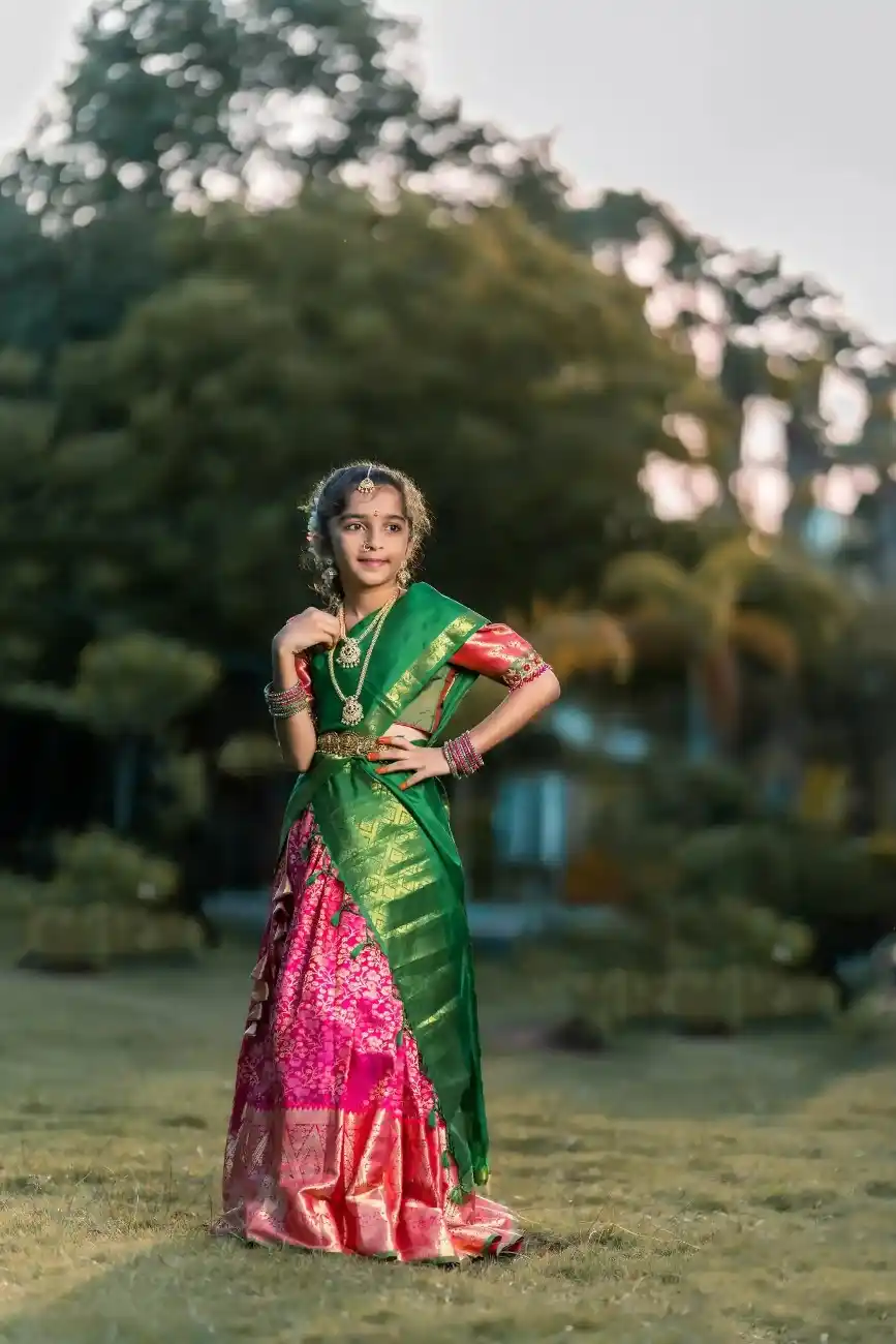 Girl posing gracefully in traditional half saree