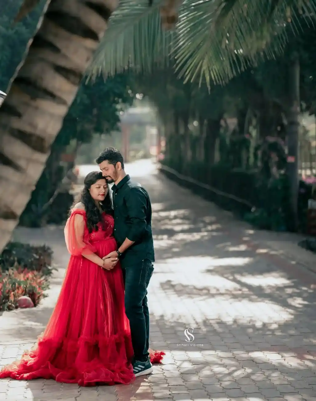 Romantic expecting couple portrait with baby bump