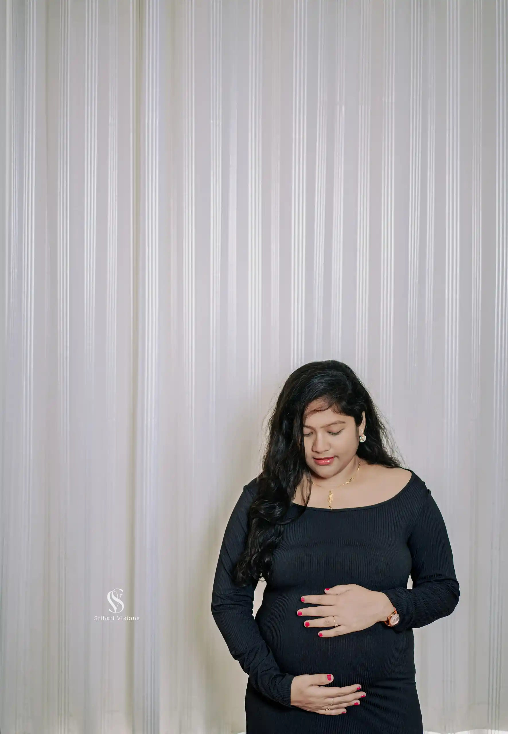 Graceful mother-to-be posing for a maternity photography session