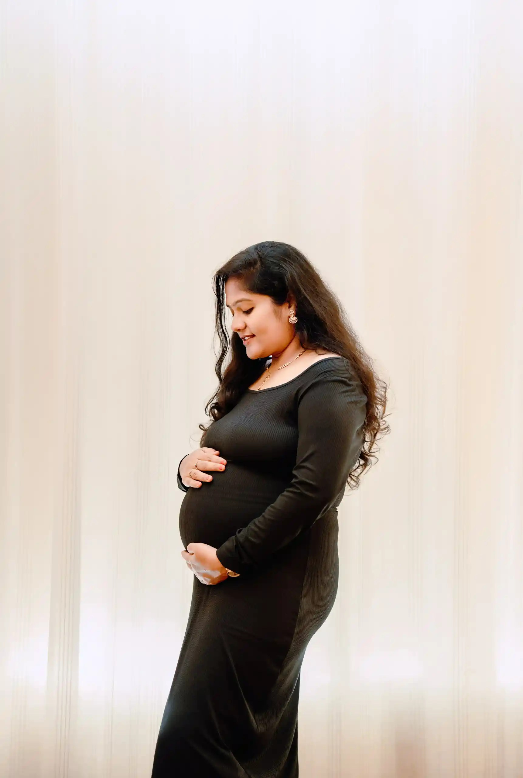 Elegant pregnant mother portrait captured during maternity photography