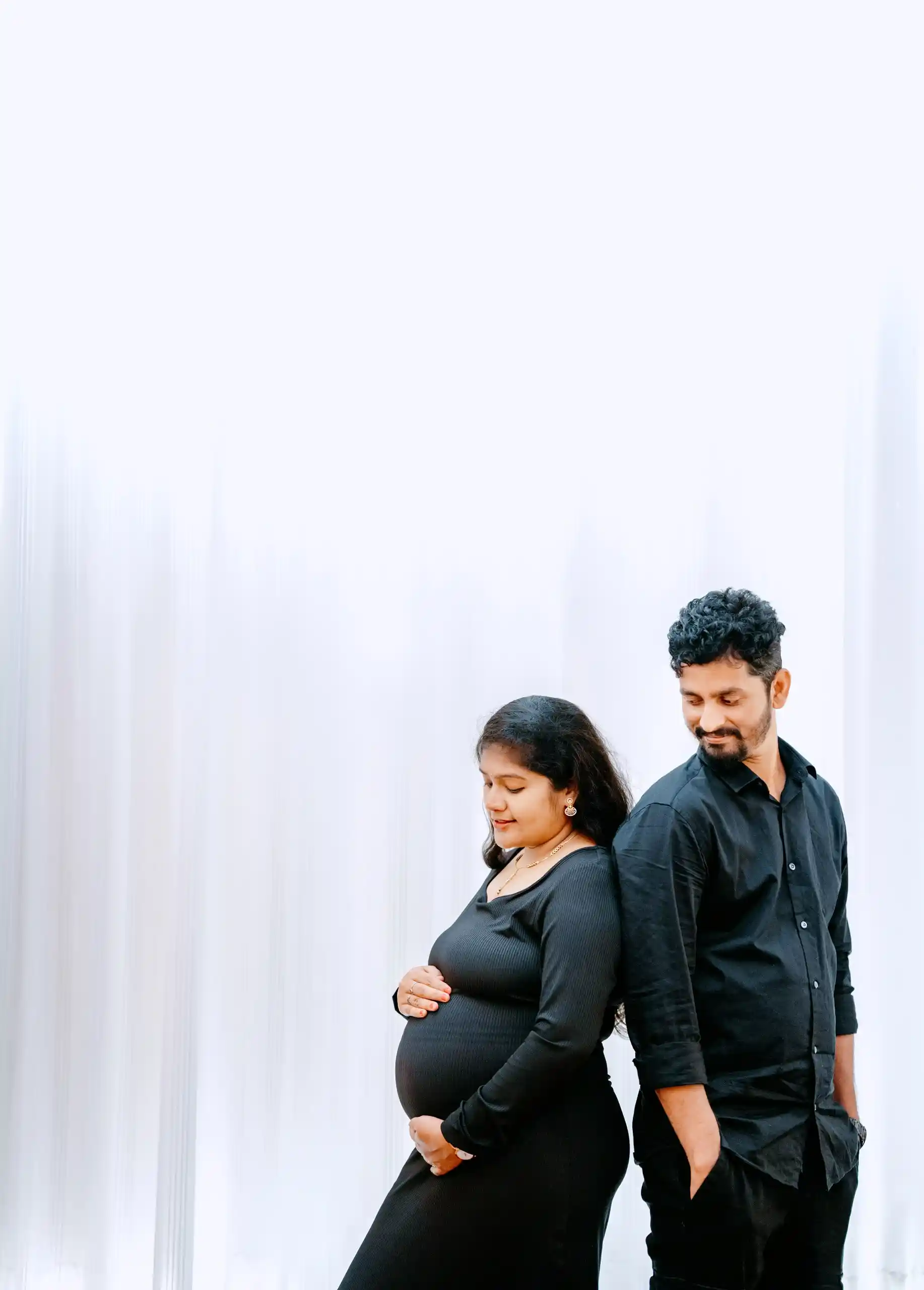 Pregnant mother and husband during maternity photography