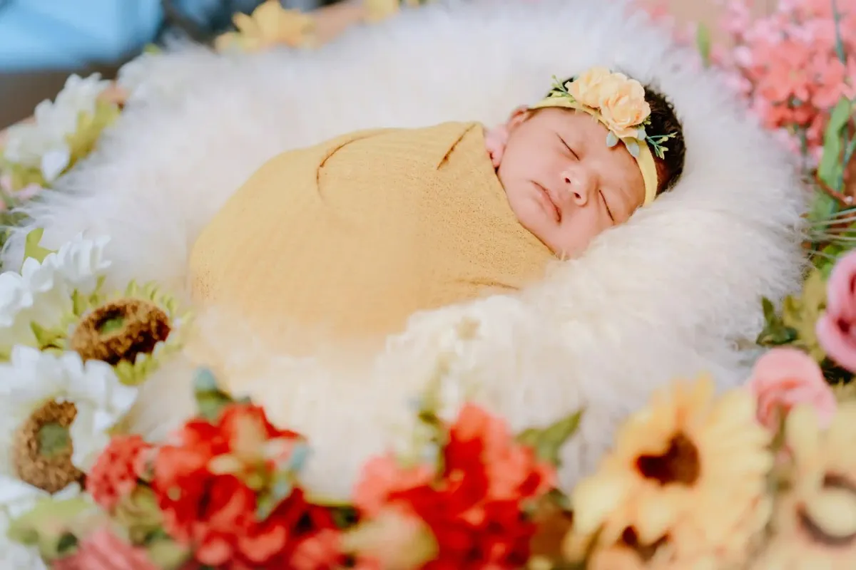 Newborn baby resting peacefully during professional photoshoot