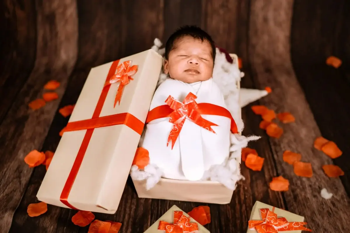Newborn baby sleeping in an adorable photography setup