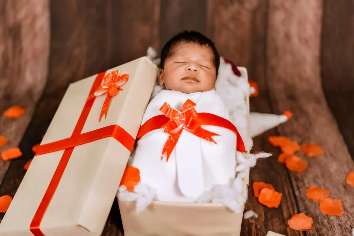 Cute newborn baby sleeping peacefully during a photoshoot