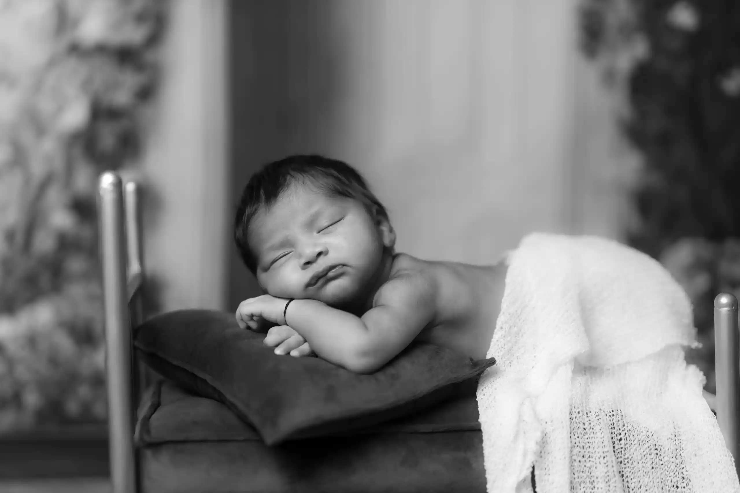 Sleeping newborn baby during newborn baby photoshoot